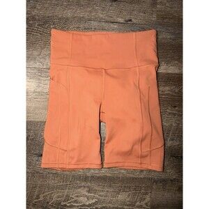 Athleta Women's Size XS Orange Ultimate Stash Pocket 7" Biker Shorts